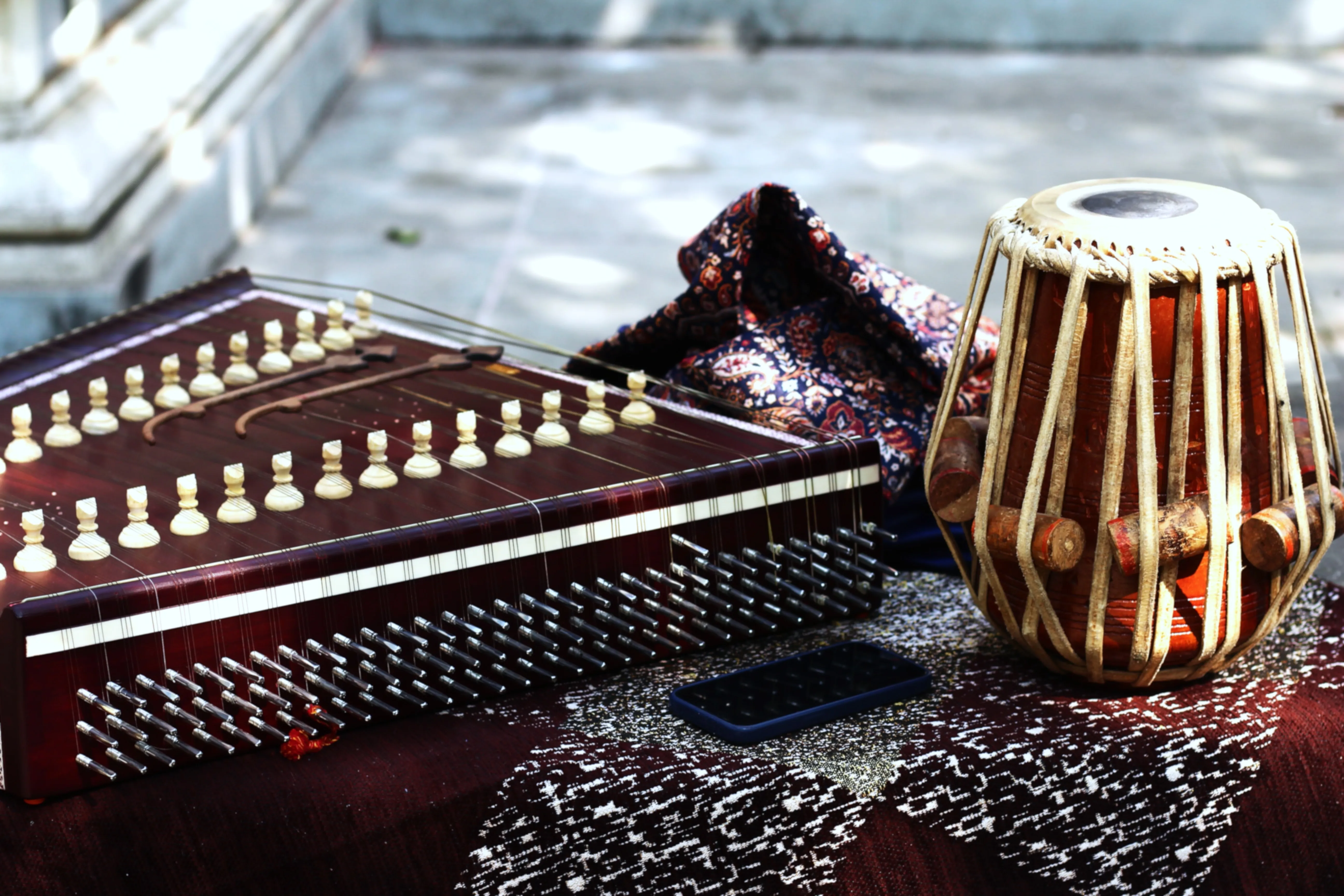 Student playing tabla confidently for family and friends